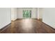 Spacious living room featuring hardwood floors and a large window with natural light at 2769 Peachtree Ne Rd # 7, Atlanta, GA 30305