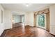 Bright living room with hardwood floors, crown molding, and large windows with drapes at 2769 Peachtree Ne Rd # 7, Atlanta, GA 30305