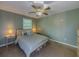 This bedroom features a ceiling fan and two side tables at 907 Olde Mill Ln, Norcross, GA 30093