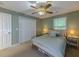 Bedroom featuring a ceiling fan, closet, and two side tables at 907 Olde Mill Ln, Norcross, GA 30093