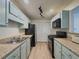 Efficient kitchen with stainless steel appliances and ample cabinet space for cooking convenience at 907 Olde Mill Ln, Norcross, GA 30093