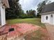Backyard patio leading to a large, grassy, and private yard at 1098 Oakdale Ne Rd, Atlanta, GA 30307