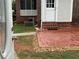 Backyard with tiled patio, brick steps, and small river rock landscaping at 1098 Oakdale Ne Rd, Atlanta, GA 30307