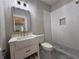 Updated bathroom with a frameless glass shower, marble floors, and a stylish vanity at 1098 Oakdale Ne Rd, Atlanta, GA 30307