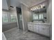 Bright bathroom with marble floors, soaking tub, dual sink vanity, and glass shower at 1098 Oakdale Ne Rd, Atlanta, GA 30307