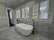 Bright bathroom with marble floors, soaking tub, adjacent to privacy window at 1098 Oakdale Ne Rd, Atlanta, GA 30307