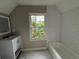 Bright bathroom with a large window, white subway tile, and vanity at 1098 Oakdale Ne Rd, Atlanta, GA 30307