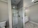 Bathroom features white-tiled shower with glass door and contemporary vanity at 1098 Oakdale Ne Rd, Atlanta, GA 30307