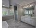 Bright bathroom with marble floors, soaking tub, dual sink vanity, and glass shower at 1098 Oakdale Ne Rd, Atlanta, GA 30307