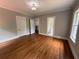 Spacious bedroom with hardwood floors, neutral paint, and an ensuite bathroom at 1098 Oakdale Ne Rd, Atlanta, GA 30307