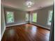 Spacious bedroom with hardwood floors and three windows offering ample natural light at 1098 Oakdale Ne Rd, Atlanta, GA 30307