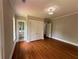 Bedroom featuring hardwood floors, neutral paint, and a walk-in closet at 1098 Oakdale Ne Rd, Atlanta, GA 30307