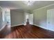 Spacious bedroom features neutral paint, hardwood floors, and adjacent ensuite at 1098 Oakdale Ne Rd, Atlanta, GA 30307