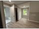 Bedroom featuring hardwood floors, natural light, and an en suite bathroom with tub at 1098 Oakdale Ne Rd, Atlanta, GA 30307