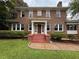 Two-story brick home with a red tile roof and manicured landscaping at 1098 Oakdale Ne Rd, Atlanta, GA 30307