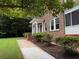 Charming brick home with a covered front porch and a lush green lawn at 1098 Oakdale Ne Rd, Atlanta, GA 30307