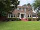 Beautiful brick two-story home with manicured landscaping and mature trees at 1098 Oakdale Ne Rd, Atlanta, GA 30307