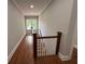 Bright hallway with hardwood floors and natural light from window at end of hall at 1098 Oakdale Ne Rd, Atlanta, GA 30307
