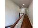 Long hallway with hardwood floors, neutral paint, and classic trim at 1098 Oakdale Ne Rd, Atlanta, GA 30307