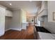 Spacious, open floor plan with custom white cabinetry and countertops, hardwood floors and modern appliances at 1098 Oakdale Ne Rd, Atlanta, GA 30307