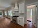 Bright kitchen with white cabinets, stainless steel appliances, and quartz countertops; designed with style at 1098 Oakdale Ne Rd, Atlanta, GA 30307