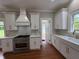 Bright kitchen with white cabinets, stainless steel appliances, and quartz countertops; designed with style at 1098 Oakdale Ne Rd, Atlanta, GA 30307
