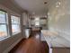 Stylish kitchen featuring white cabinetry, quartz countertops, and modern lighting fixtures at 1098 Oakdale Ne Rd, Atlanta, GA 30307