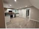 Kitchen featuring modern appliances, white cabinets, granite countertops, and light wood flooring at 1098 Oakdale Ne Rd, Atlanta, GA 30307