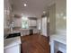 Modern kitchen with white cabinets, stainless steel appliances, and quartz countertops for cooking at 1098 Oakdale Ne Rd, Atlanta, GA 30307