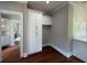 Bright kitchen features custom white cabinetry with gold hardware and beautiful hardwood flooring at 1098 Oakdale Ne Rd, Atlanta, GA 30307