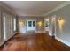 Spacious living room featuring hardwood floors, elegant trim, and natural light from multiple windows at 1098 Oakdale Ne Rd, Atlanta, GA 30307