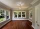 Bright living room filled with natural light featuring hardwood floors, neutral paint, and mature trees at 1098 Oakdale Ne Rd, Atlanta, GA 30307