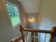 Staircase with wooden treads and white railings with a view of the lawn at 1098 Oakdale Ne Rd, Atlanta, GA 30307