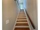 A wooden staircase with white risers offers a seamless transition between floors at 1098 Oakdale Ne Rd, Atlanta, GA 30307