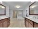 En-suite bathroom featuring dual vanities, a soaking tub, and a glass shower at 280 Woods Creek Drive, Suwanee, GA 30024