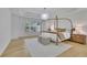 Modern bedroom with tray ceiling, stylish lighting, and contemporary furnishings at 280 Woods Creek Drive, Suwanee, GA 30024