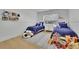 bedroom featuring blue beds, hardwood floors and playroom decor at 280 Woods Creek Drive, Suwanee, GA 30024