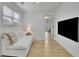Modern bedroom featuring a comfortable daybed and a mounted television at 280 Woods Creek Drive, Suwanee, GA 30024