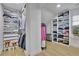 Walk-in closet with custom shelving and storage solutions at 280 Woods Creek Drive, Suwanee, GA 30024