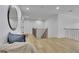 Upstairs hallway with hardwood floors, black metal railings, seating and a large mirror at 280 Woods Creek Drive, Suwanee, GA 30024