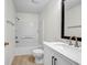 Bathroom featuring a marble countertop, modern sink and faucet, plus tub shower with white tile at 3073 Waldrop Cir, Decatur, GA 30034