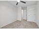 Empty bedroom featuring carpet, a ceiling fan, and two doors leading to other rooms at 3073 Waldrop Cir, Decatur, GA 30034