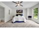 Bedroom with carpet, a ceiling fan, and a world map hanging above the comfortable bed at 3073 Waldrop Cir, Decatur, GA 30034