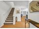 Inviting entryway showcasing hardwood floors and staircase, leading to open living spaces at 3073 Waldrop Cir, Decatur, GA 30034