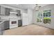 Bright kitchen featuring stainless steel appliances, grey cabinets, and eat in area at 3073 Waldrop Cir, Decatur, GA 30034