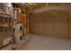 Basement features an energy efficient furnace, water heater, and concrete flooring at 5581 Fox Glove Ct, Douglasville, GA 30135