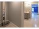 Basement bathroom featuring gray walls, tiled floors, modern sink and vanity at 5581 Fox Glove Ct, Douglasville, GA 30135