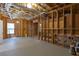 Unfinished basement with exposed beams and utilities, and a grey painted concrete floor at 5581 Fox Glove Ct, Douglasville, GA 30135