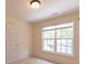 A cozy bedroom with a large window with nature views and plenty of natural light at 5581 Fox Glove Ct, Douglasville, GA 30135