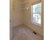 A well-organized walk-in closet with shelving and a window, perfect for storage and natural light at 5581 Fox Glove Ct, Douglasville, GA 30135